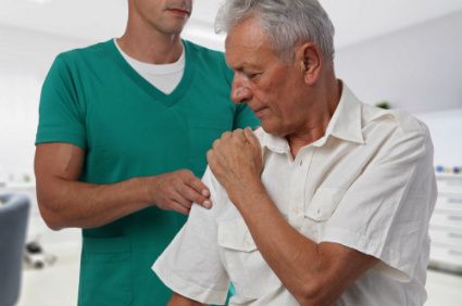 A man having chiropractic back adjustment